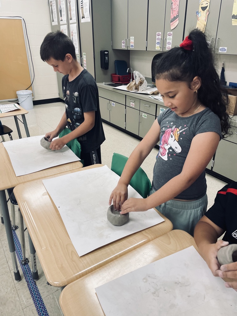May Overby students working on clay pumpkins