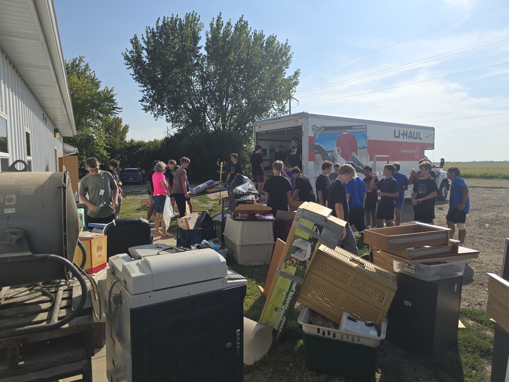 Football players helped load up donated furniture for the AAHS Second Paw Sale.