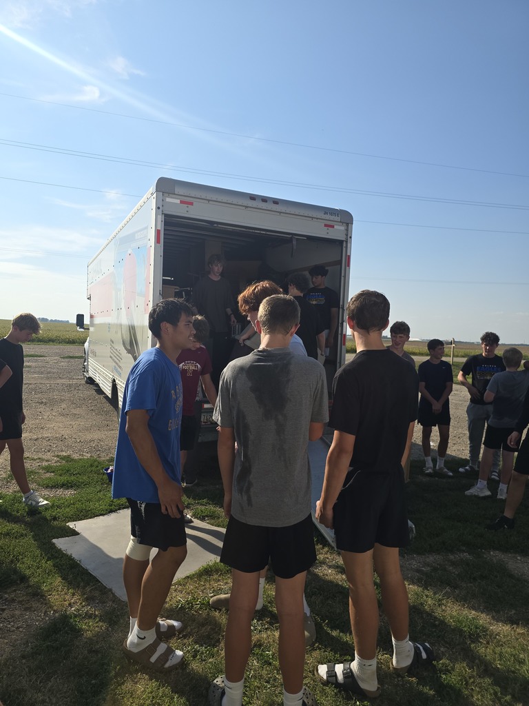 Football players helped load up donated furniture for the AAHS Second Paw Sale.