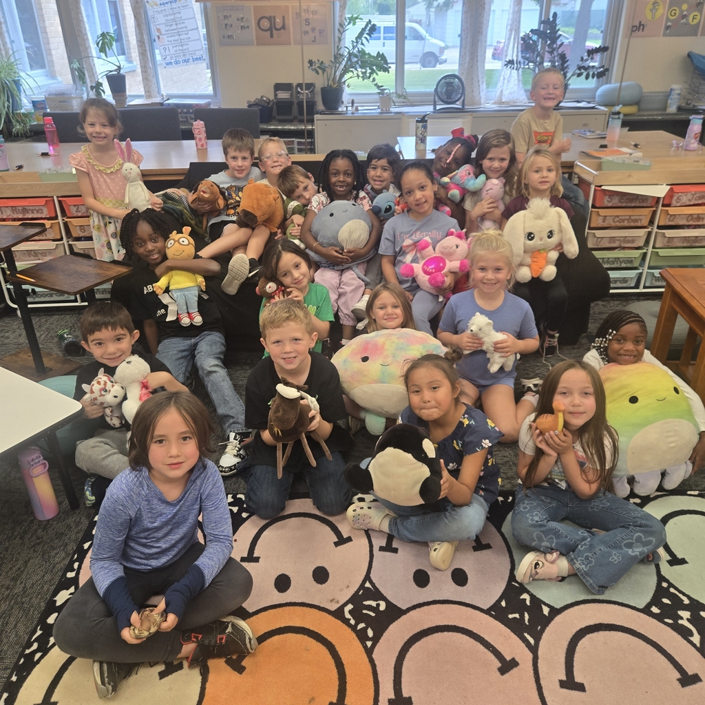 children smiling with stuffed animals