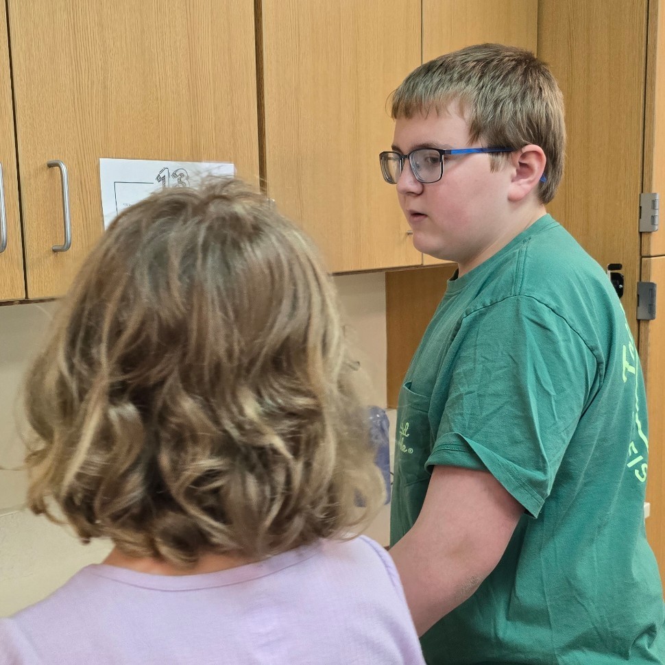 Students in language arts work together to find figurative language.