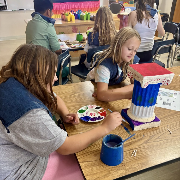 Students paint pillars in art!