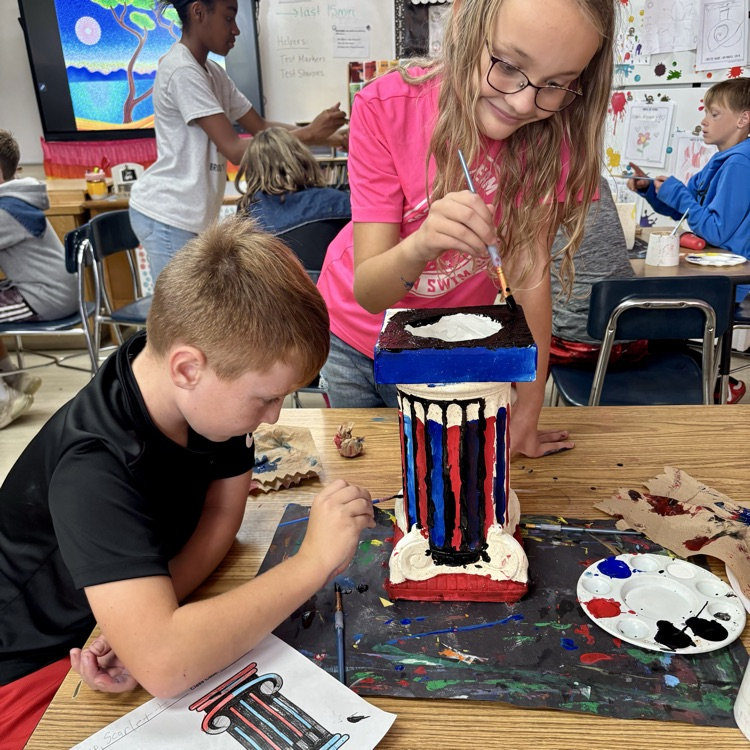 Students paint pillars in art!