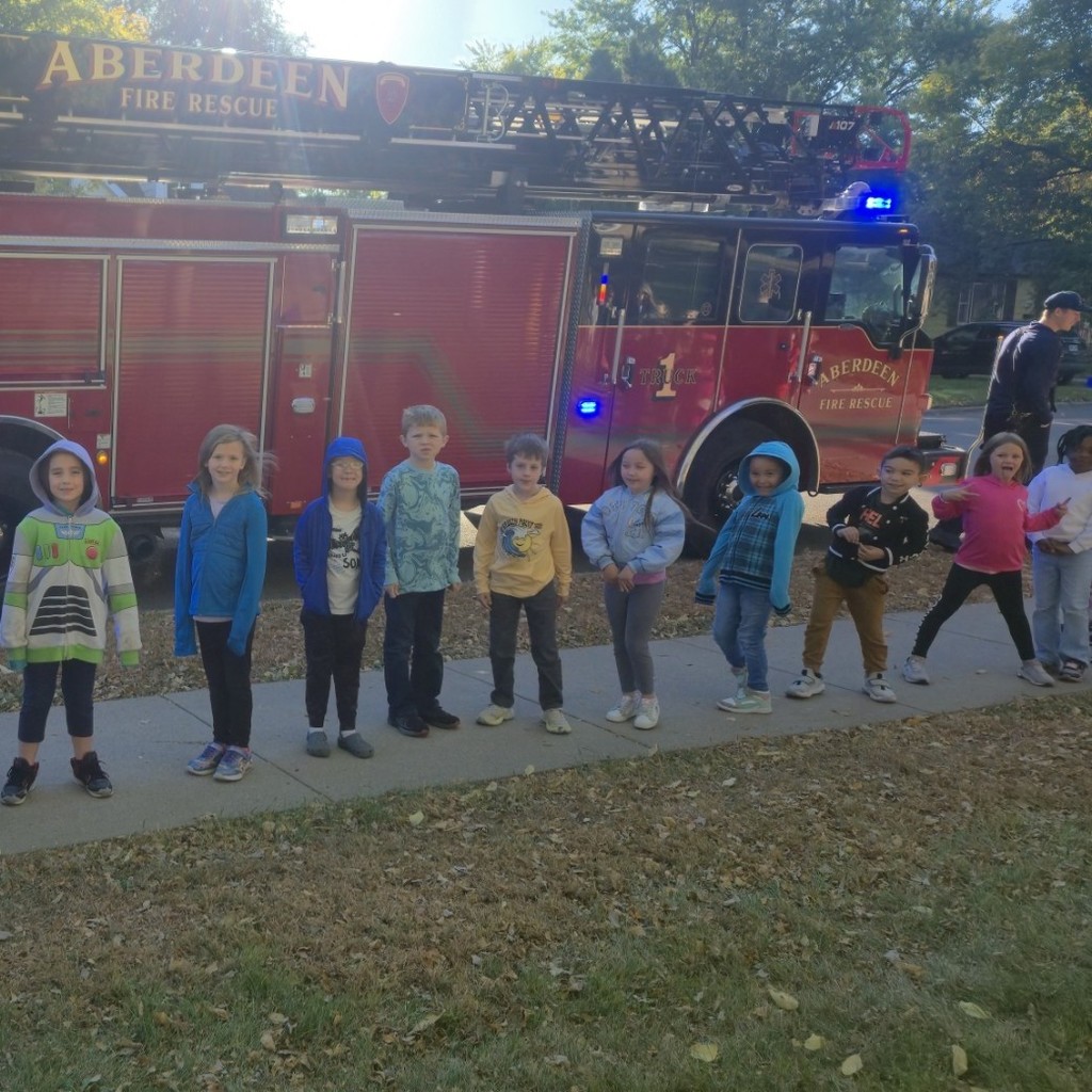 First graders in front of a fire truck