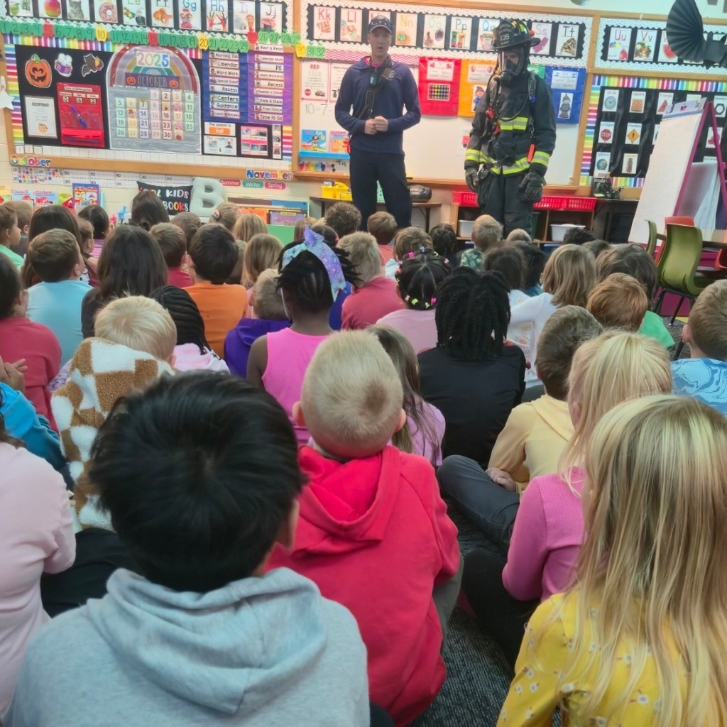 kids listening to firefighters