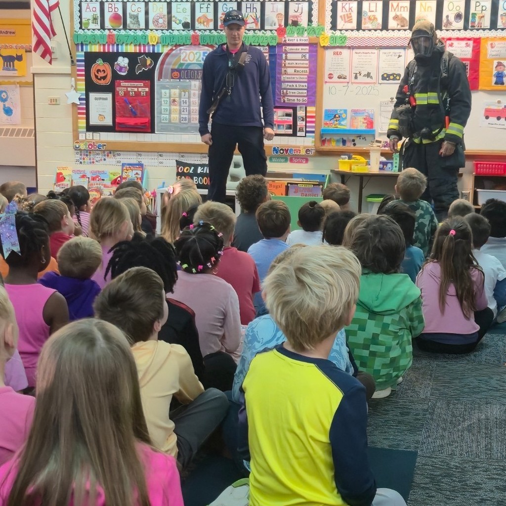 kids listening to firefighters