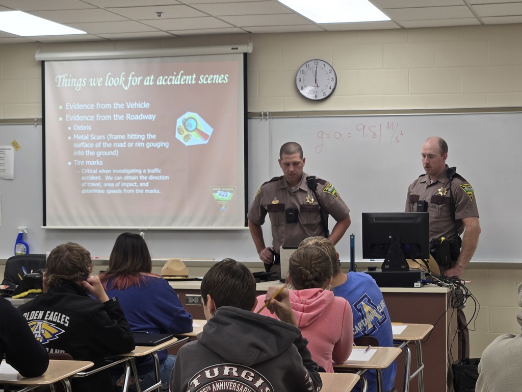 South Dakota State Troopers presenting about the physics concepts they use to reconstruct the scene of a crash