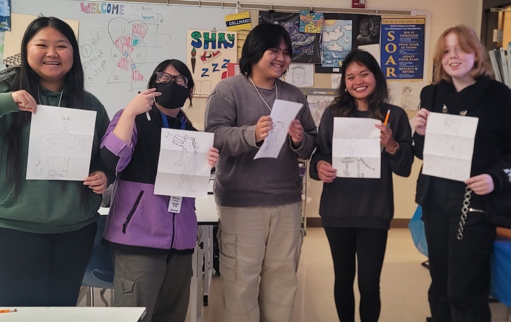 Students holding their 'Exquisite Corpse'  Surrealist drawings made in art club!