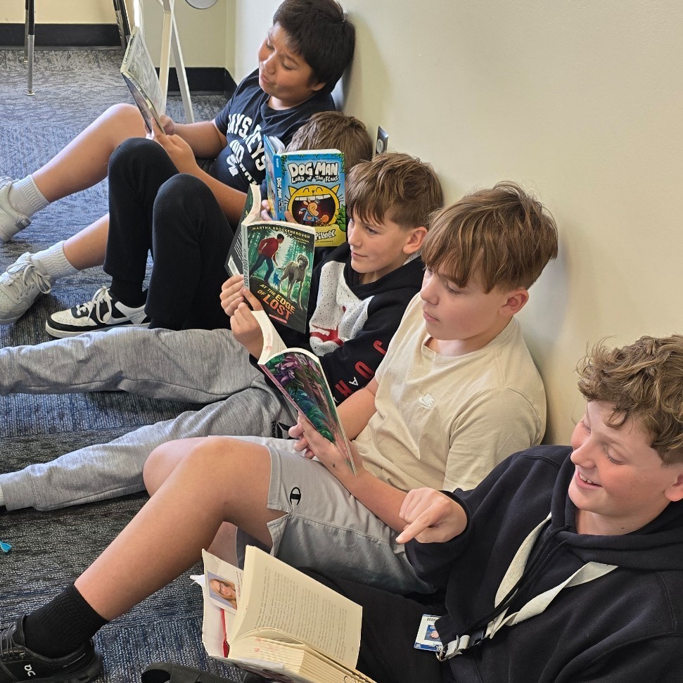 6th graders relax with good books.