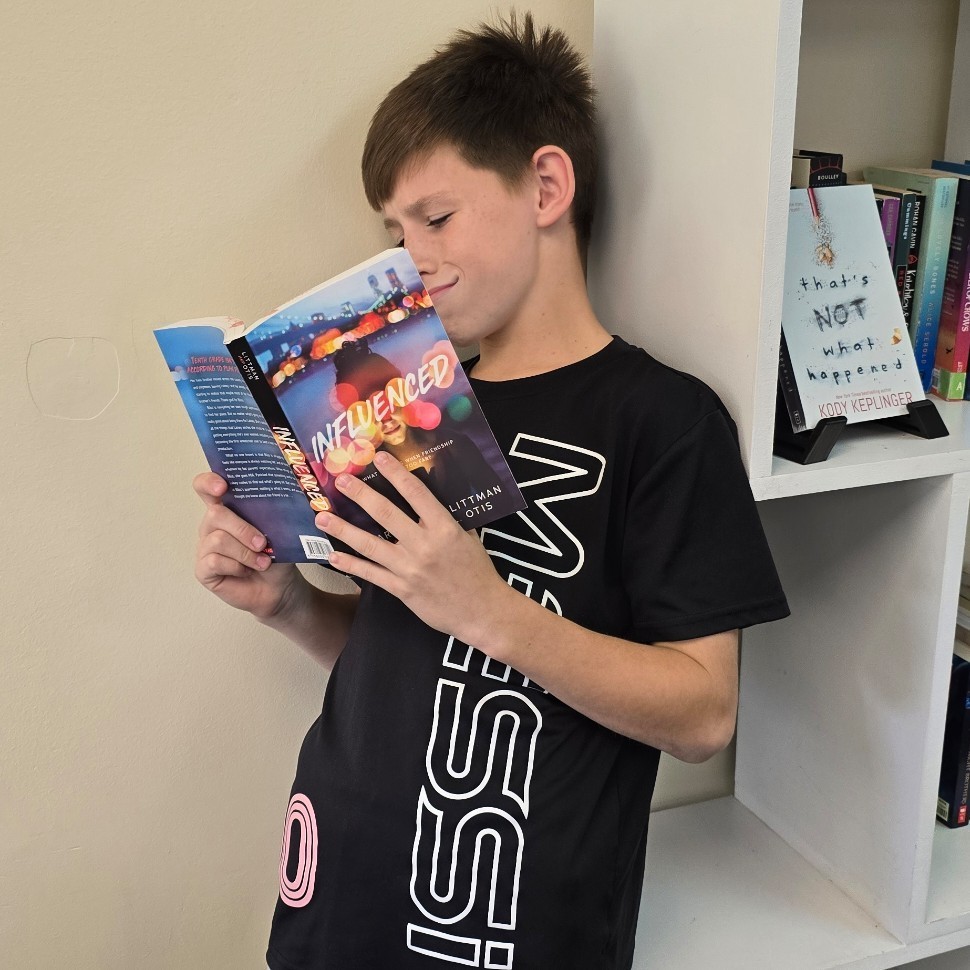 6th graders relax with good books.