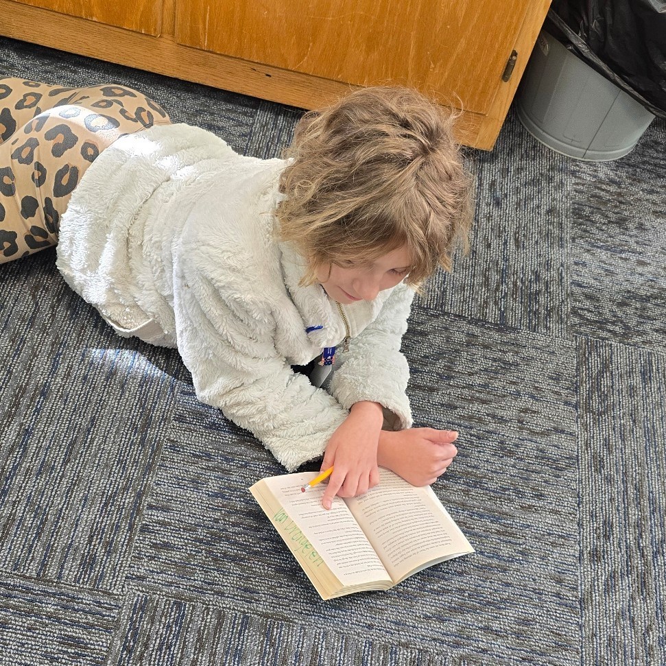 6th graders relax with good books.