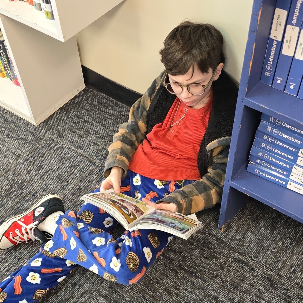 6th graders relax with good books.