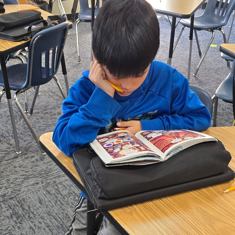 6th graders relax with good books.