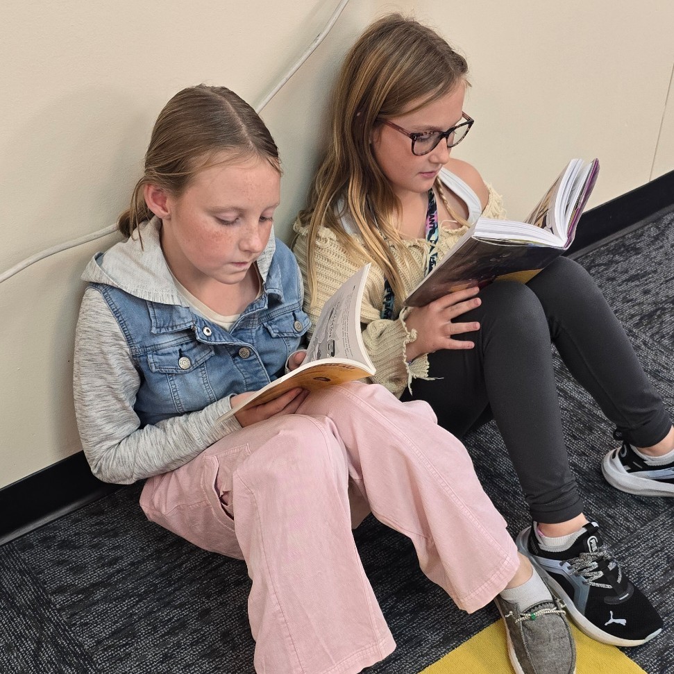 6th graders relax with good books.