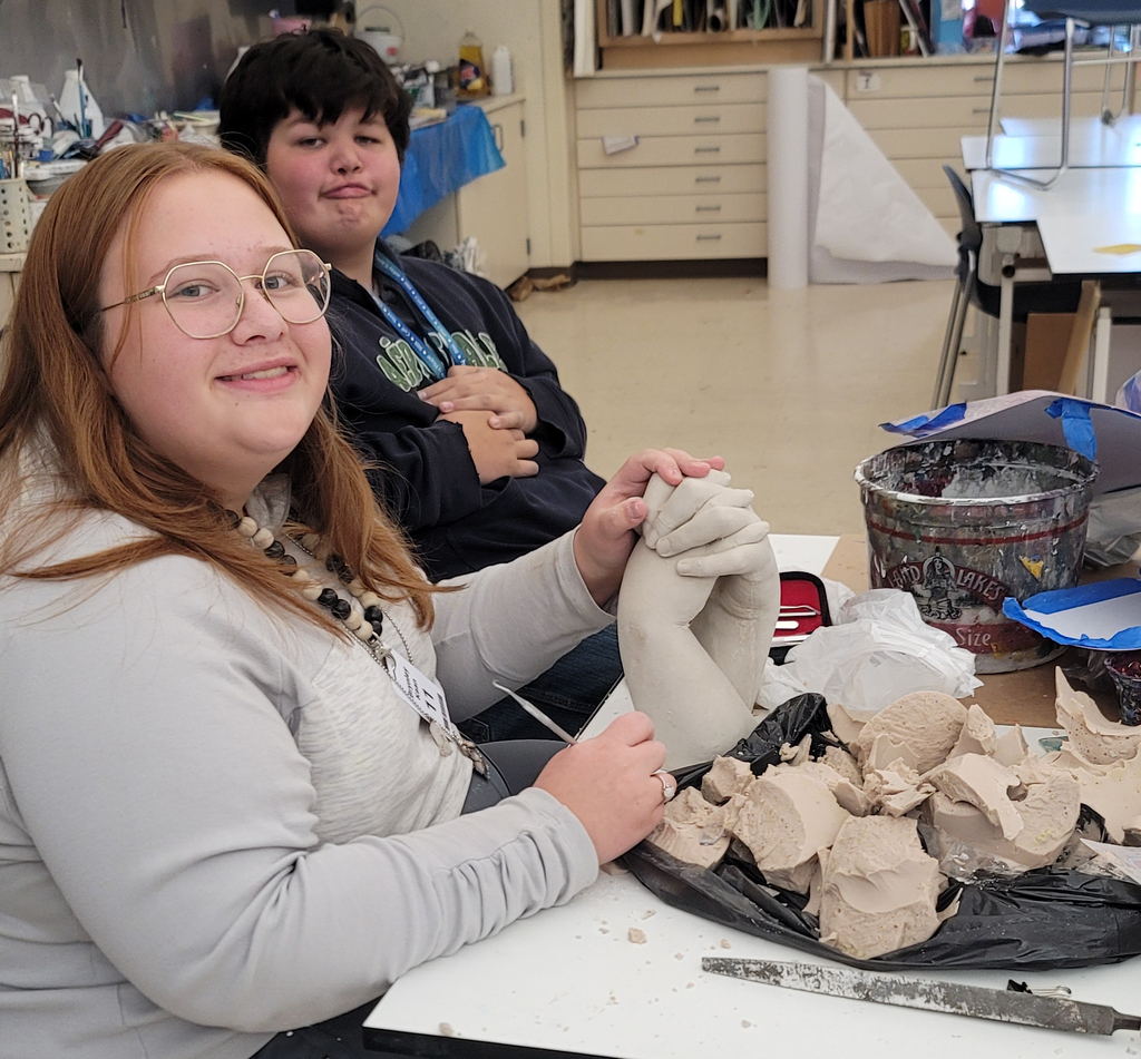 Brynley Kaan is cleaning up her plaster mold of their cast hands!