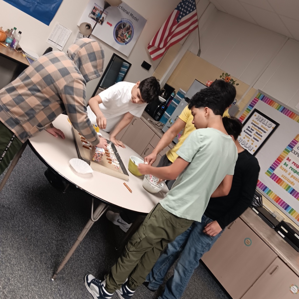 The boys enjoy making a snack.