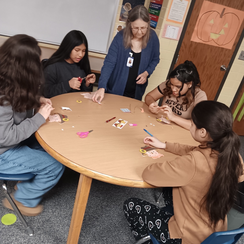 The girls are making scarecrows.