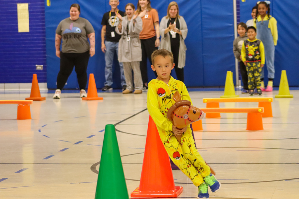 Stick horse race at May Overby