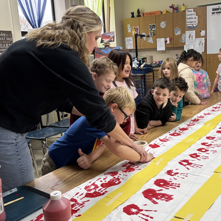 Teachers helped students press their handprints!