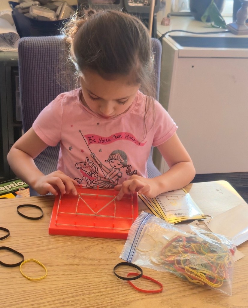 student using geoboard