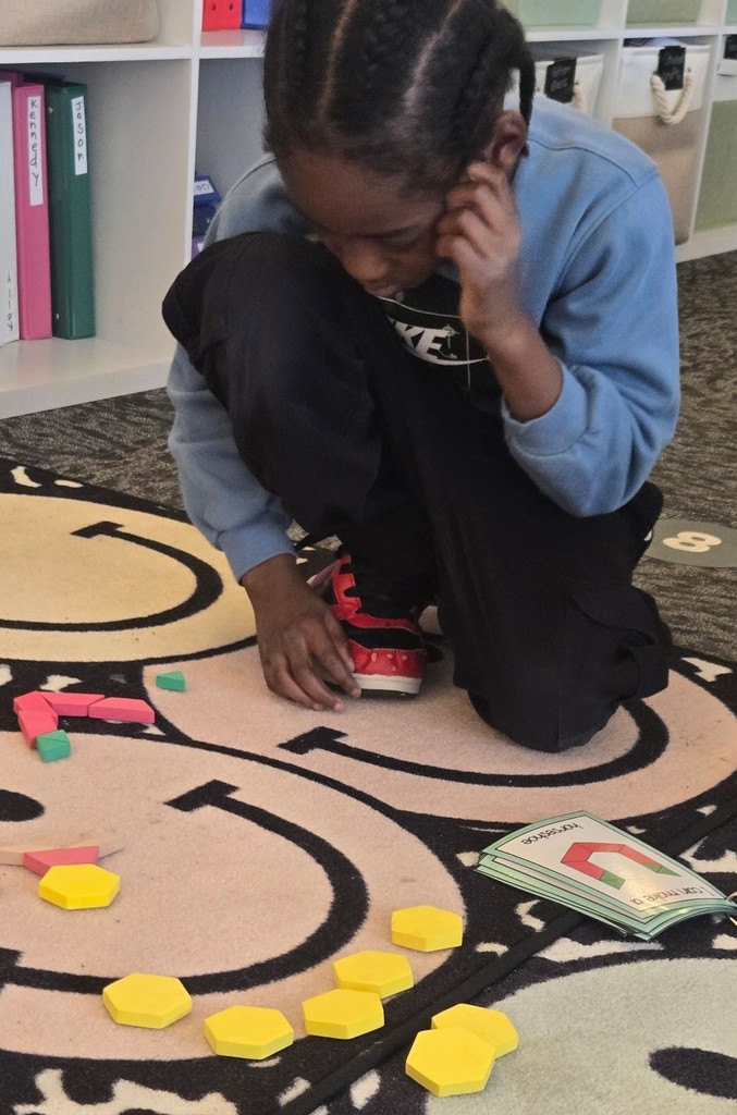 student using pattern blocks