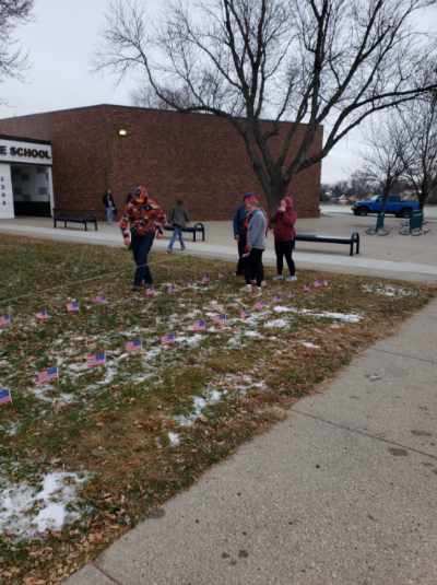 HMS students putting out flags