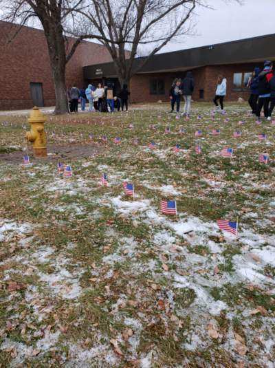 HMS students putting out flags