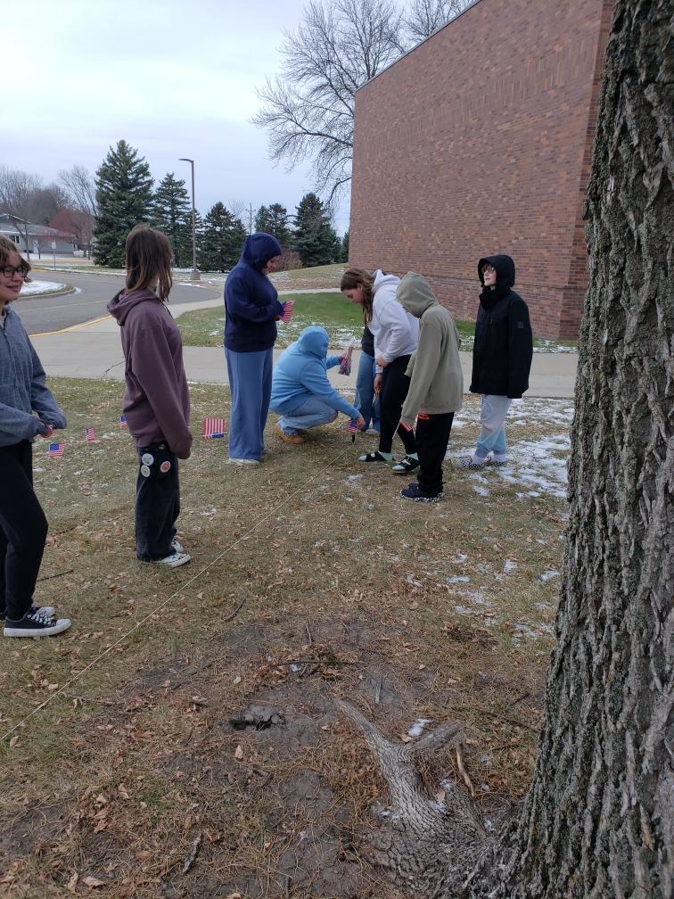 HMS students putting out flags