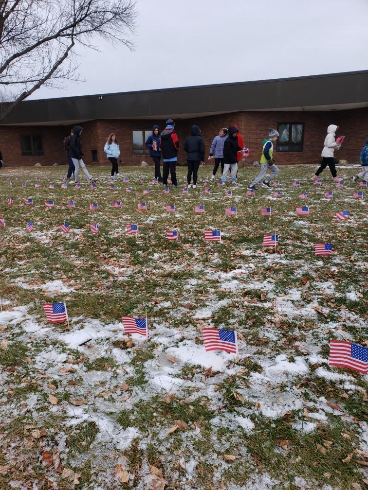 HMS students putting out flags