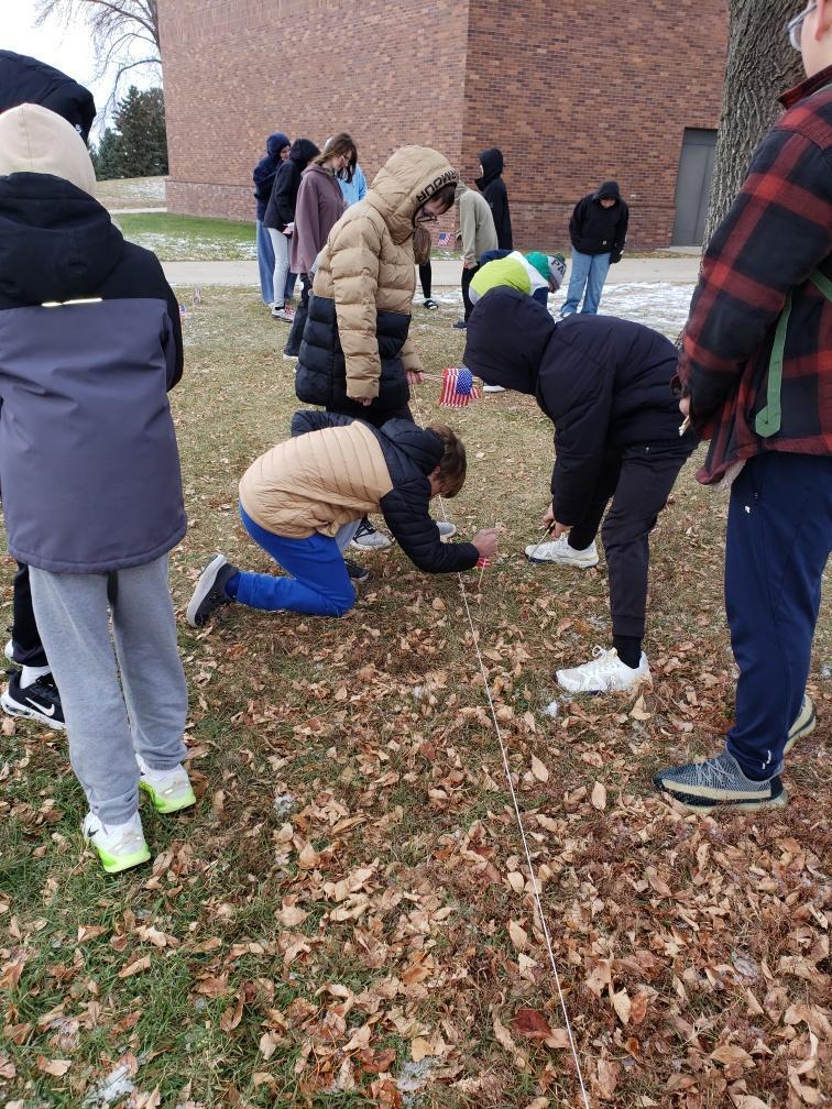 HMS students putting out flags