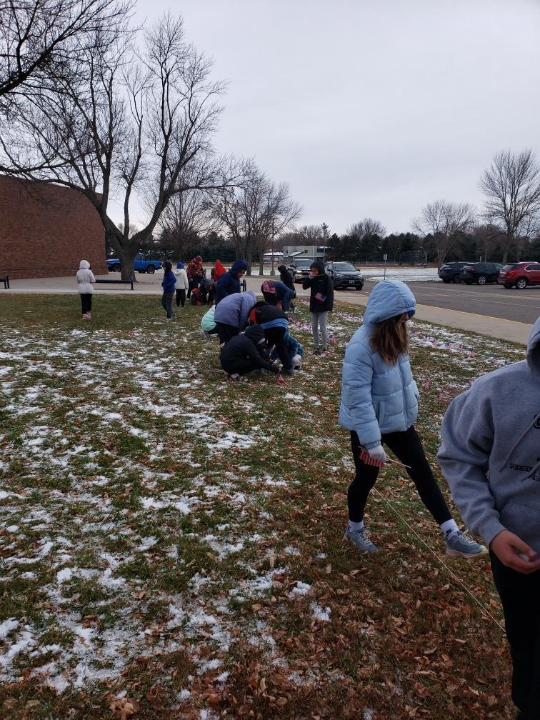 HMS students putting out flags