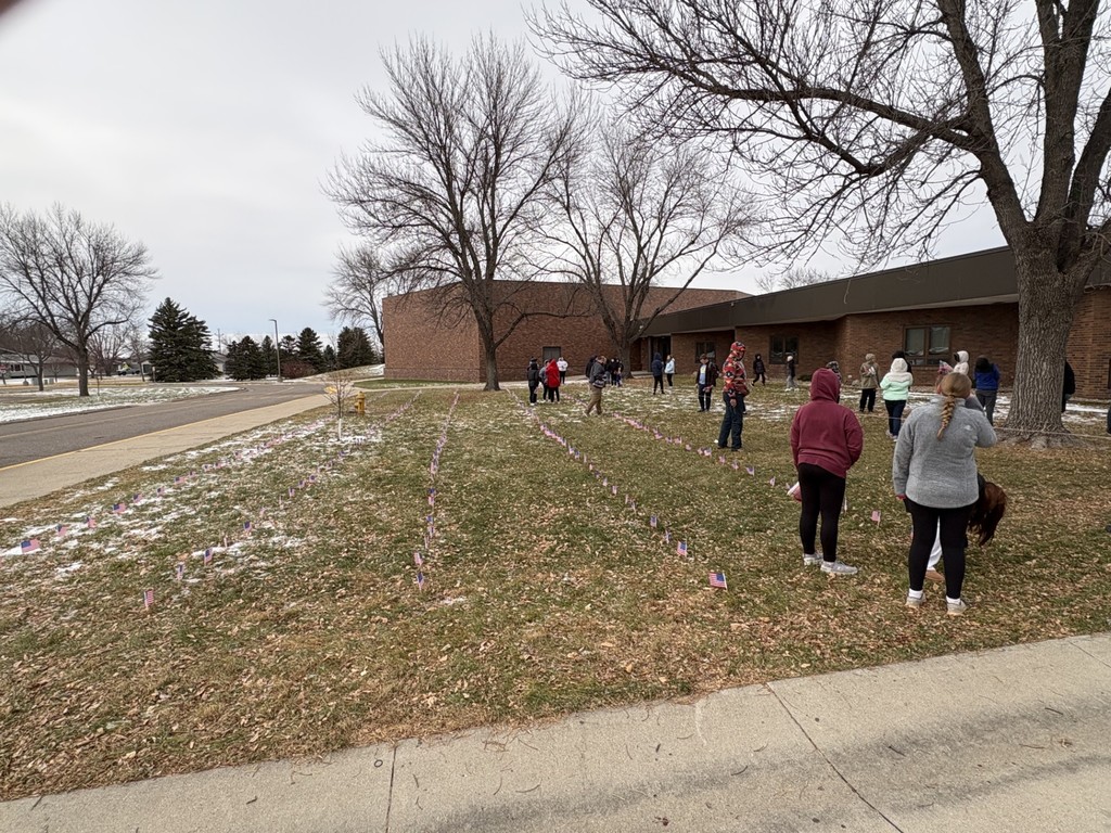 HMS students putting out flags