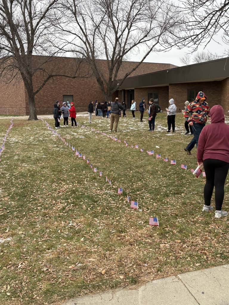 HMS students putting out flags
