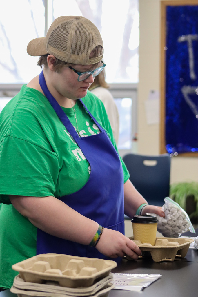 TLC student preparing a coffee shop delivery