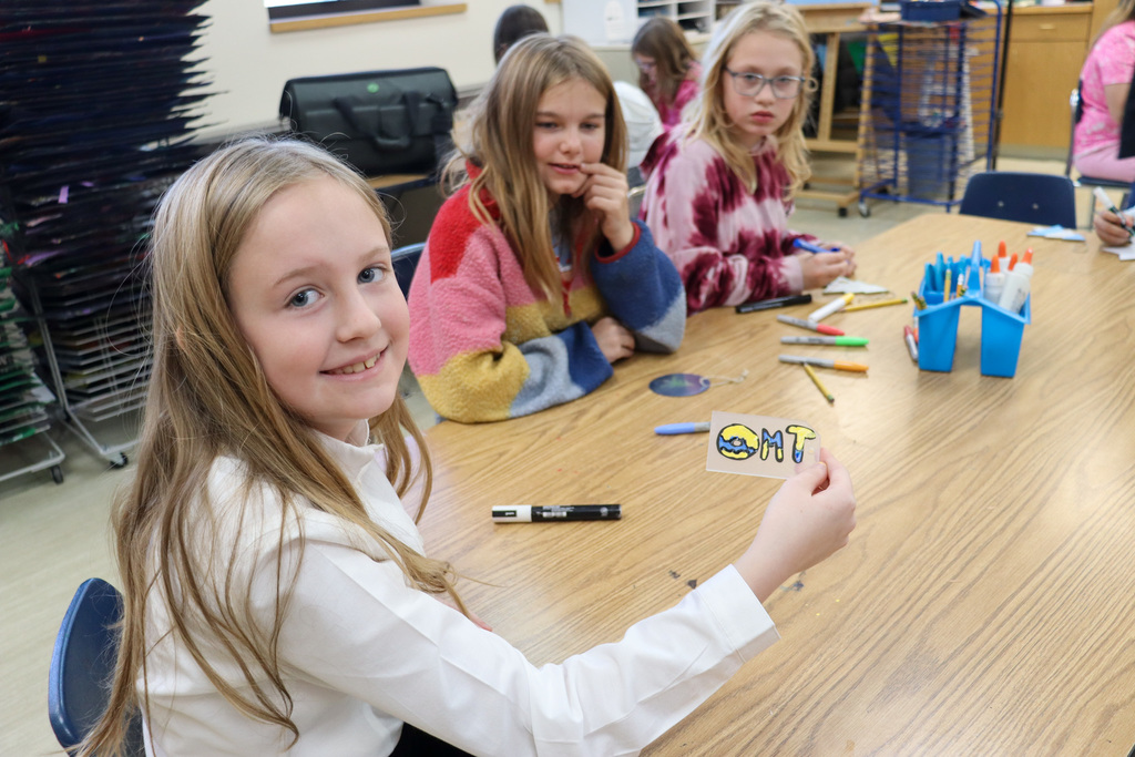 O.M. Tiffany student with her decoration for the Golden Eagle tree