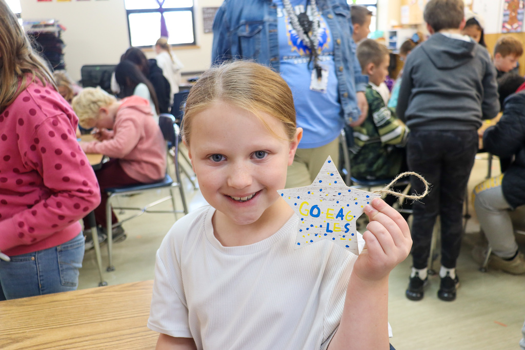 O.M. Tiffany student with her decoration for the Golden Eagle tree