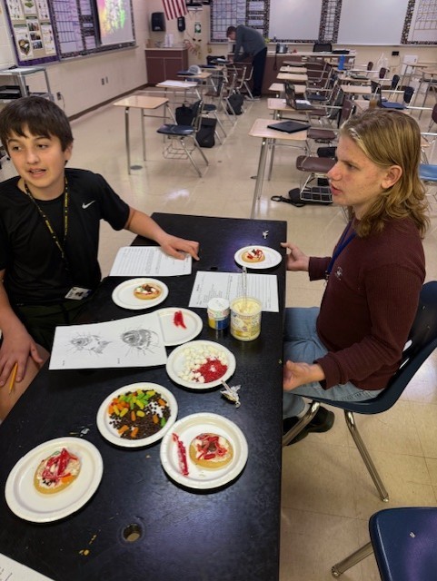 Students discuss organelle functions and justify their choices for representing each structure in their edible model.