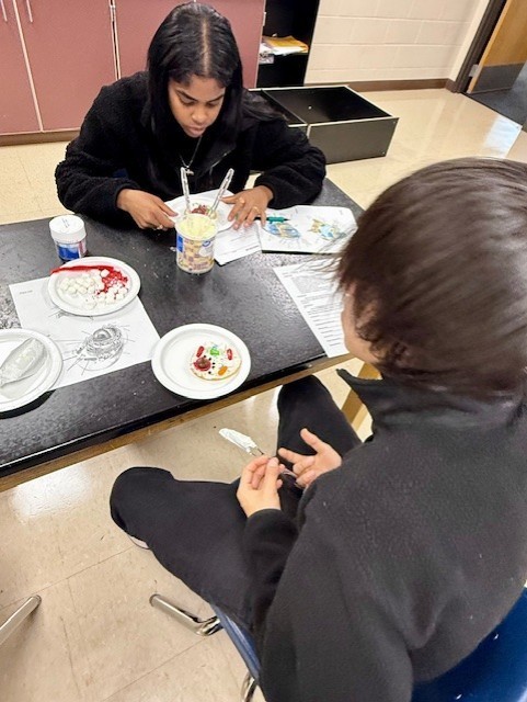 Students assemble their edible cells, matching each structure to the correct part of the diagram.