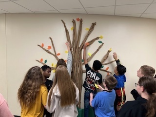 Students adding thankful leaves to our Thankful Tree. 