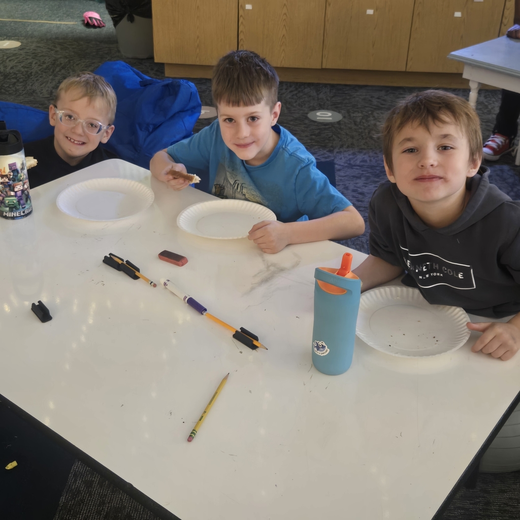 students eating bread with the butter they made!
