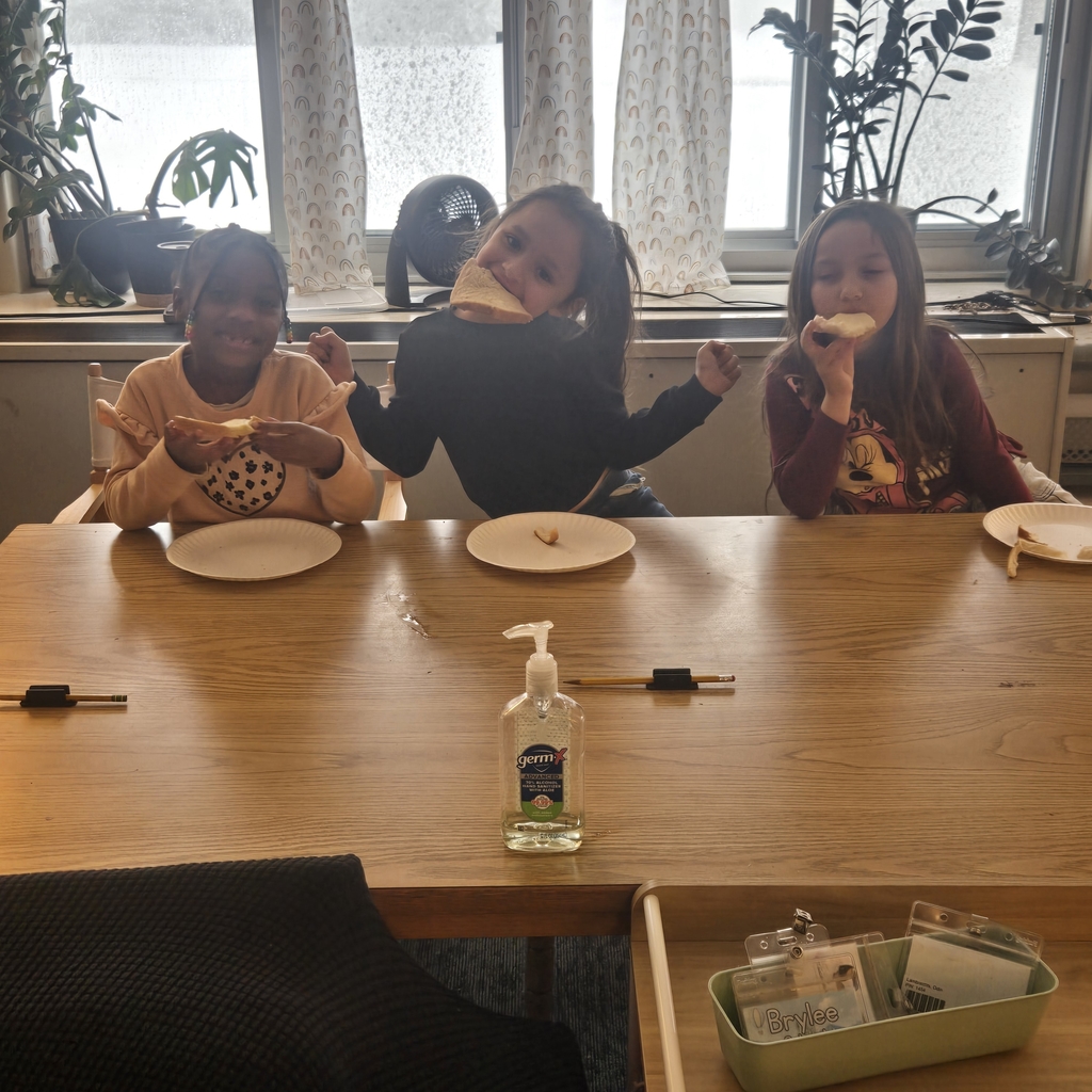 students eating bread with the butter they made!
