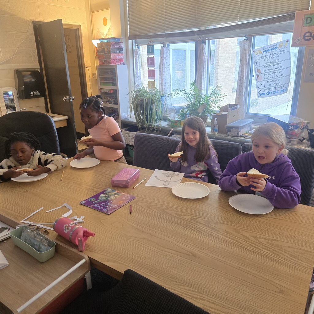 students eating bread with the butter they made!