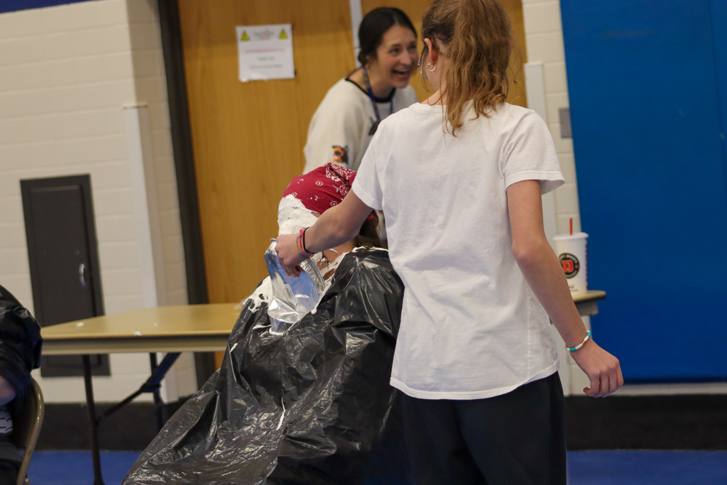 Ms. Thompson getting hit in the face with a  pie at SMS