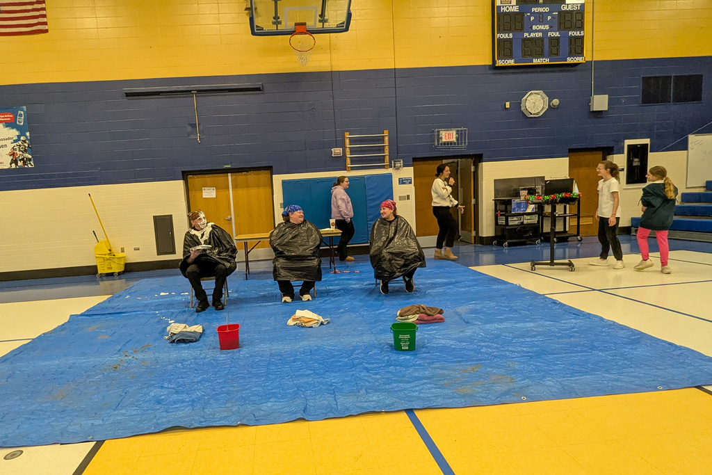 Teachers and SRO Olson getting a pie in the face at SMS