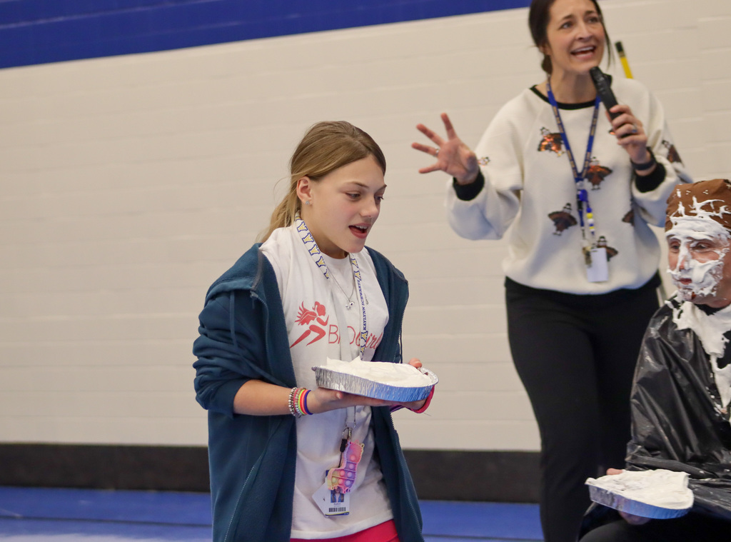 A student ready to throw a pie in the face at SMS