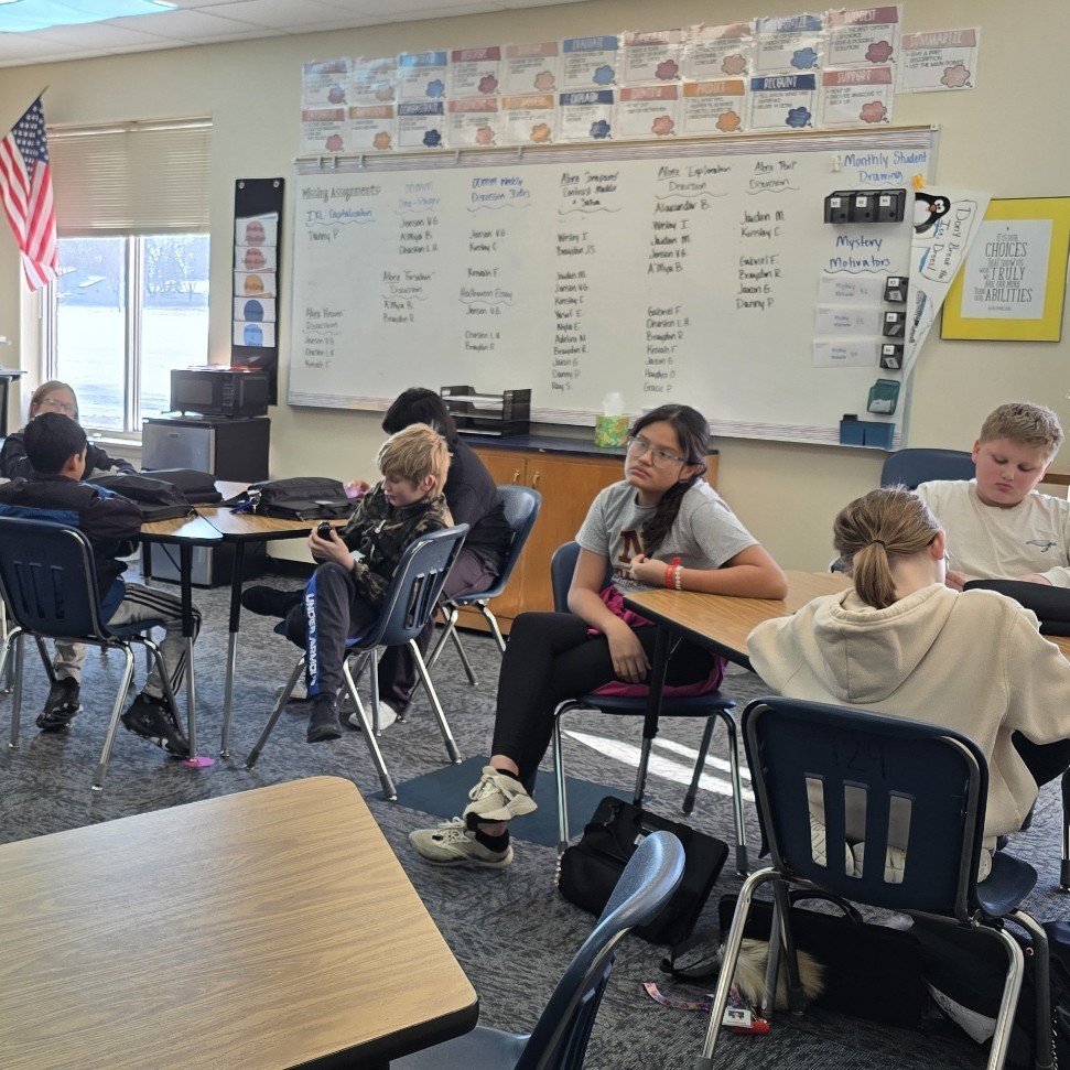 6th graders relax with a read-aloud.