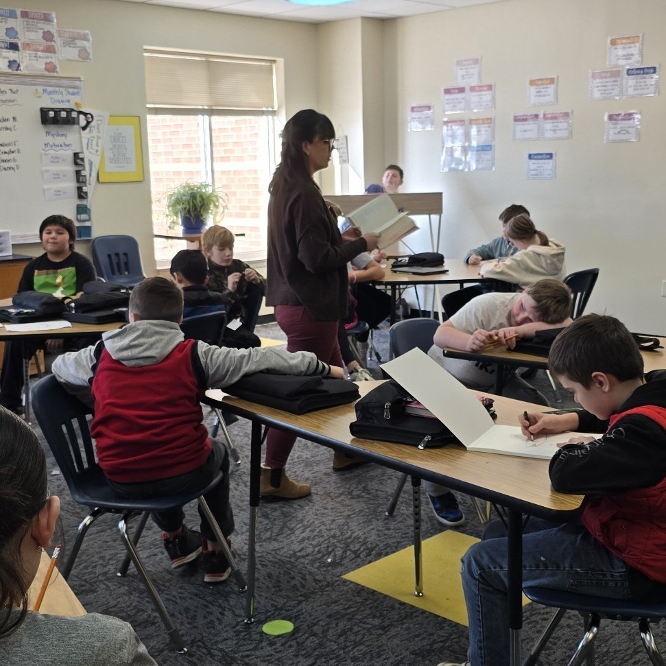 6th graders relax with a read-aloud.