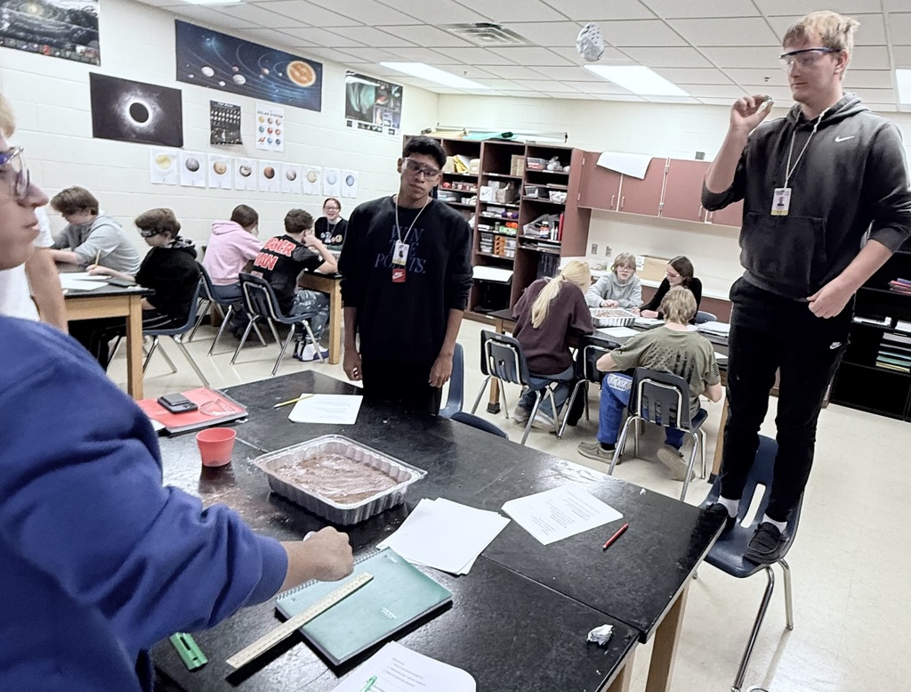 Testing how increasing drop height affects crater size in the lunar surface model.