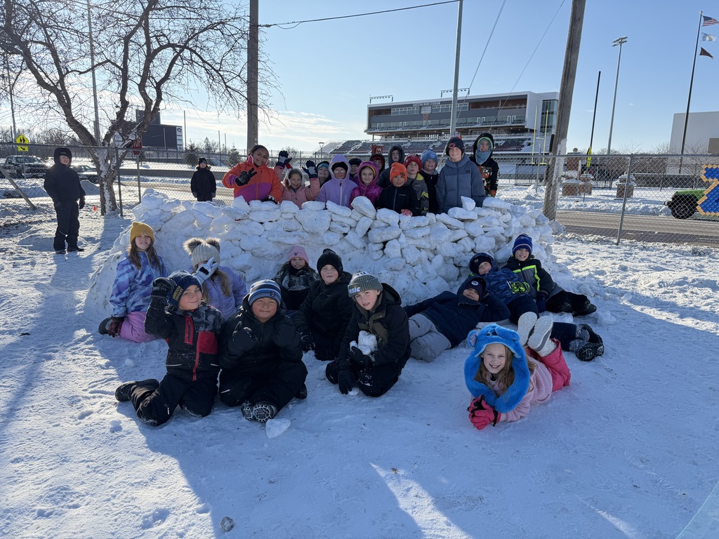 May Overby students building an igloo at recess
