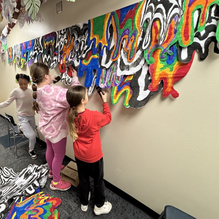 Students hang artwork